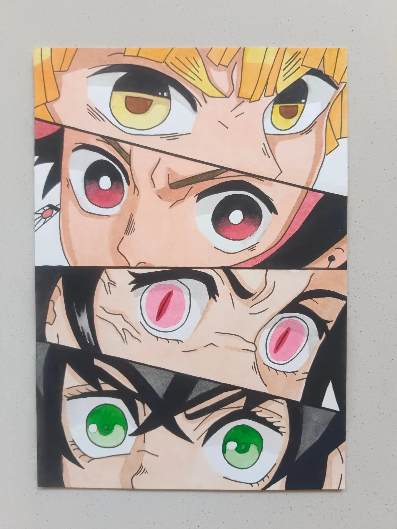 Collage of hand-painted Demon Slayer eye studies featuring Zenitsu Agatsuma, Tanjiro Kamado, Nezuko Kamado and Inosuke Hashibira close-ups.