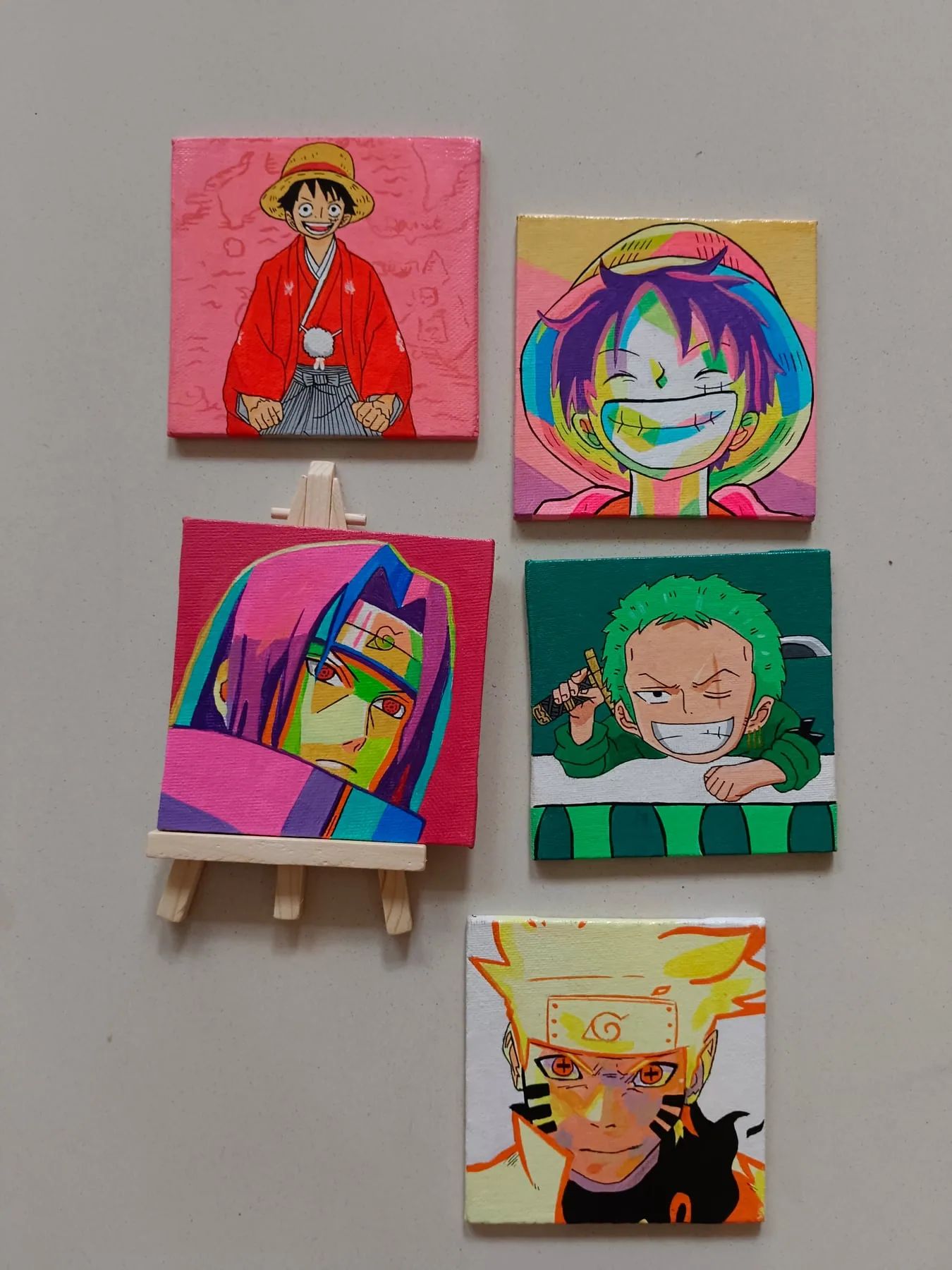 Colourful display of acrylic mini canvases featuring Monkey D. Luffy, Anya Forger, Hisoka Morow, Roronoa Zoro and Naruto Uzumaki.