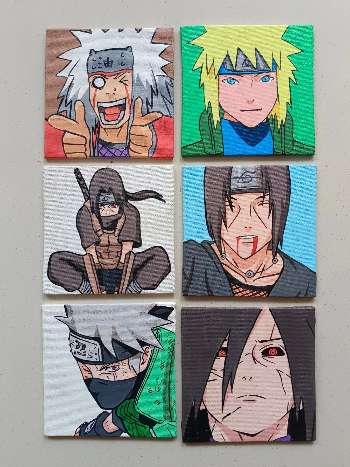 Grid of hand-painted acrylic Naruto mini canvases featuring Jiraiya, Naruto Uzumaki, Itachi Uchiha, Kakashi Hatake and other ninja portraits.