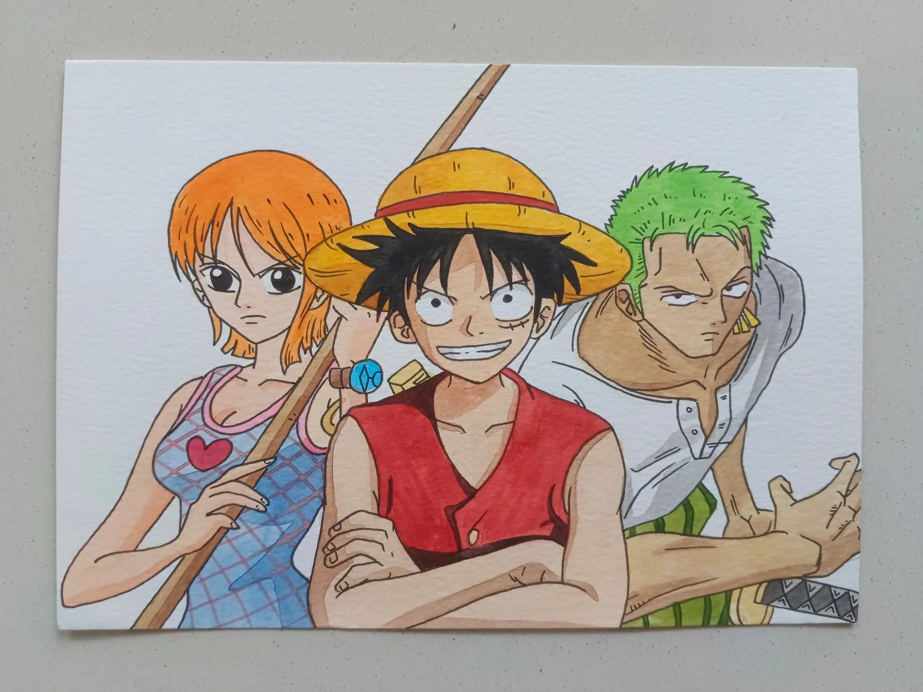 Hand-painted acrylic One Piece canvas featuring Nami, Monkey D. Luffy and Roronoa Zoro in a three-character Straw Hat group portrait.