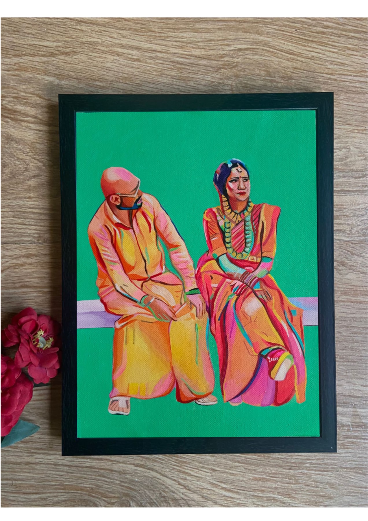 Framed acrylic painting of a couple in traditional clothing on a green background.