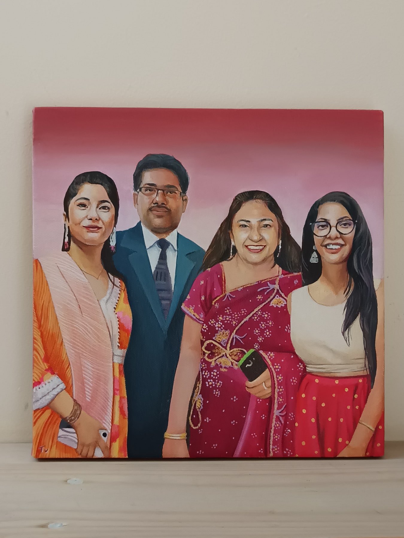 Hand-painted acrylic canvas portrait of a family of four against a soft red background.