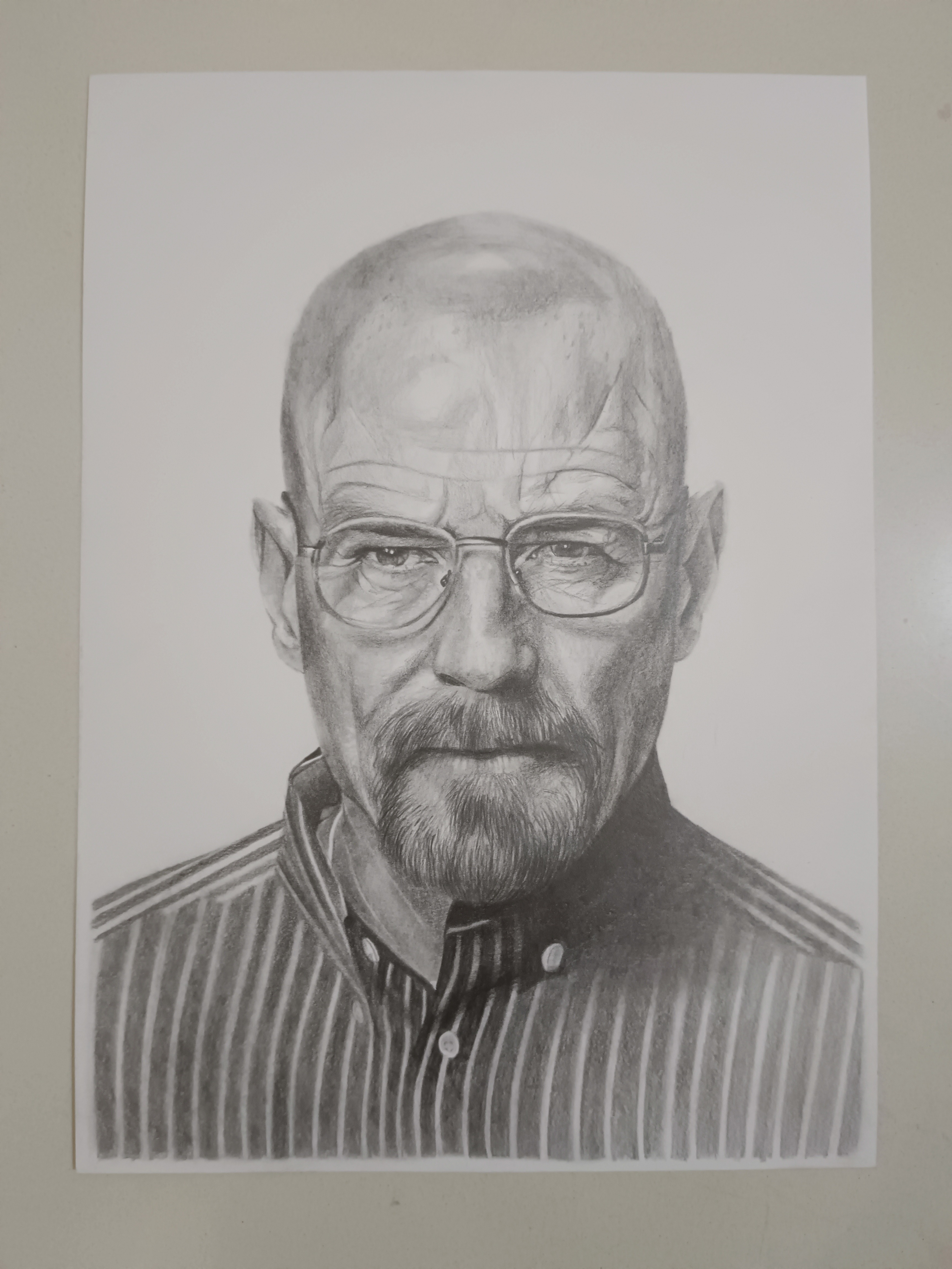 Graphite-pencil portrait of a bearded man with glasses, drawn on paper.