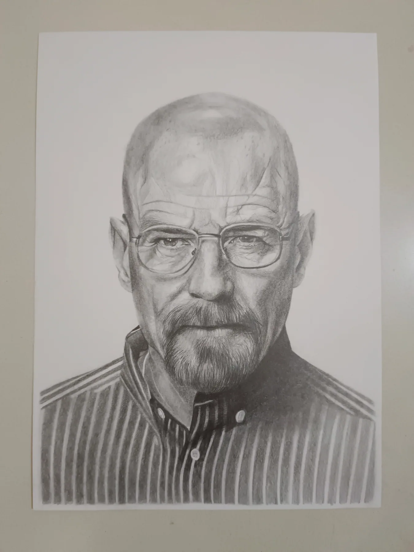 Graphite-pencil portrait of a bearded man with glasses, drawn on paper.