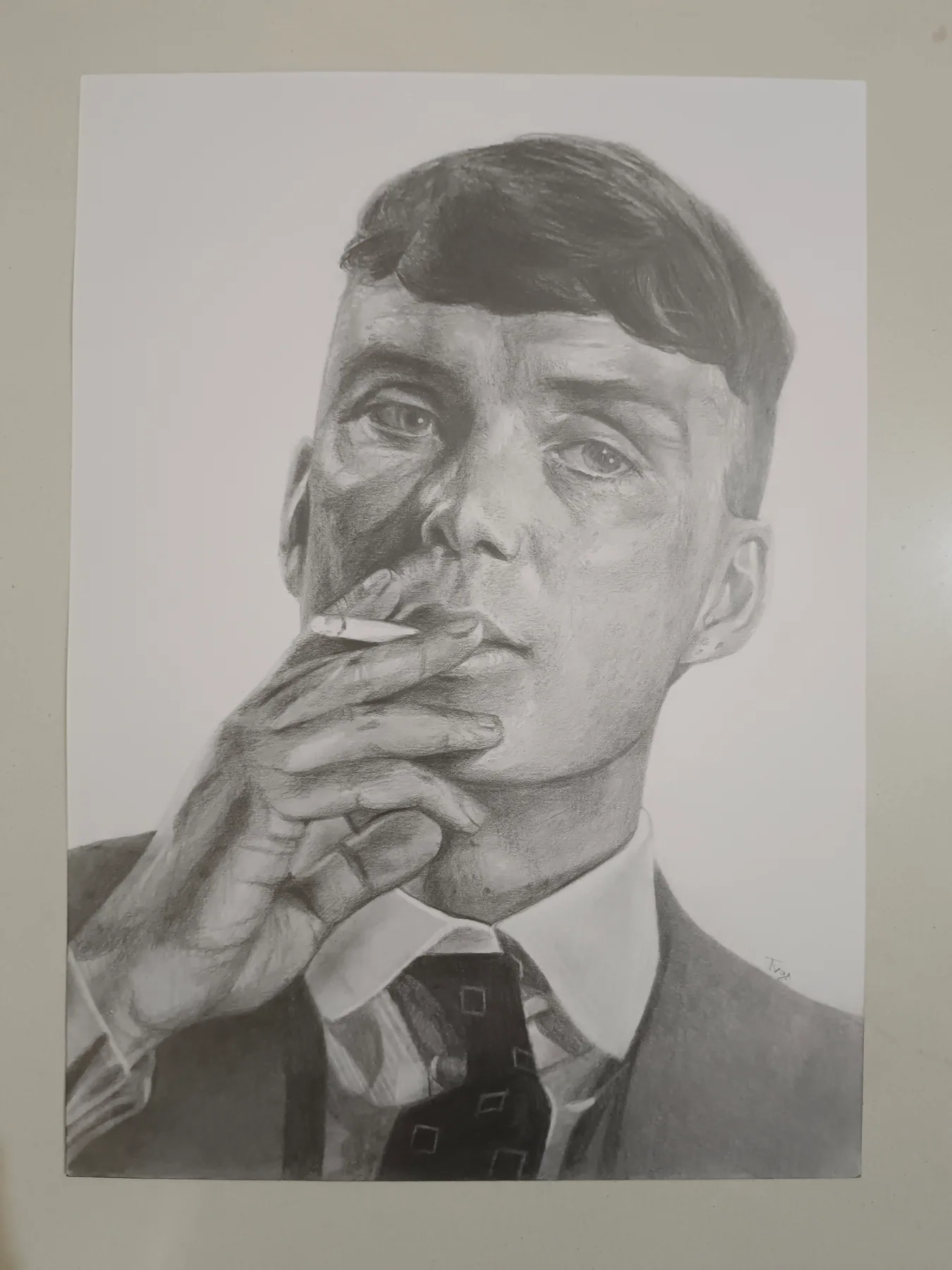 Graphite-pencil portrait of a man holding a cigarette, drawn from a photograph.