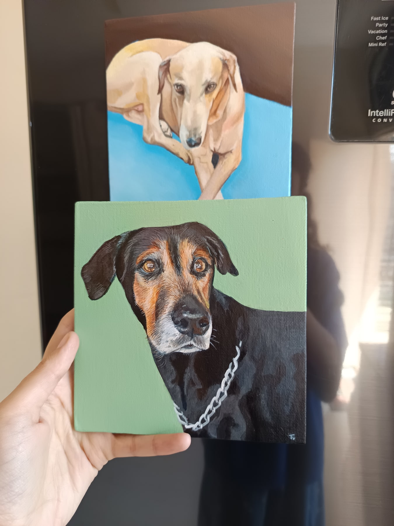 Two hand-painted acrylic dog portrait mini canvases shown with their reference photo.
